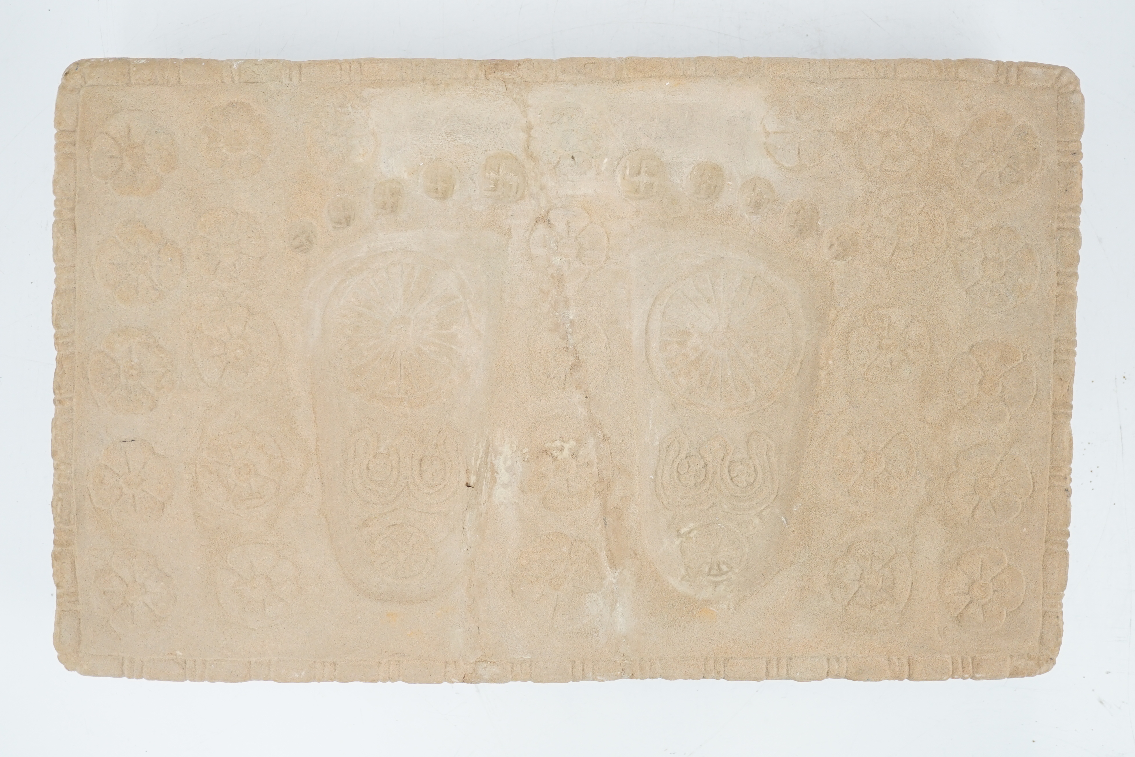 A sandstone relief of Buddha’s foot prints (Buddhapada), Southern India, 12th century